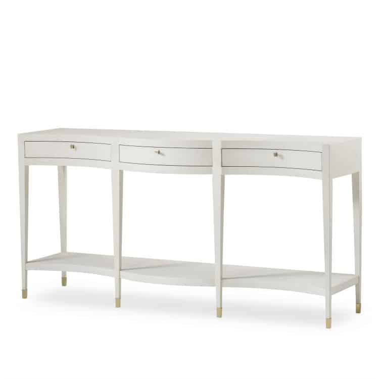 Elegant ivory faux shagreen console table, showcasing serpentine front design and brass hardware.