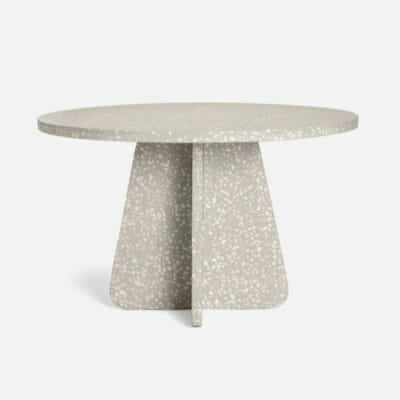 Gray mixed terrazzo outdoor dining table with curved edges.