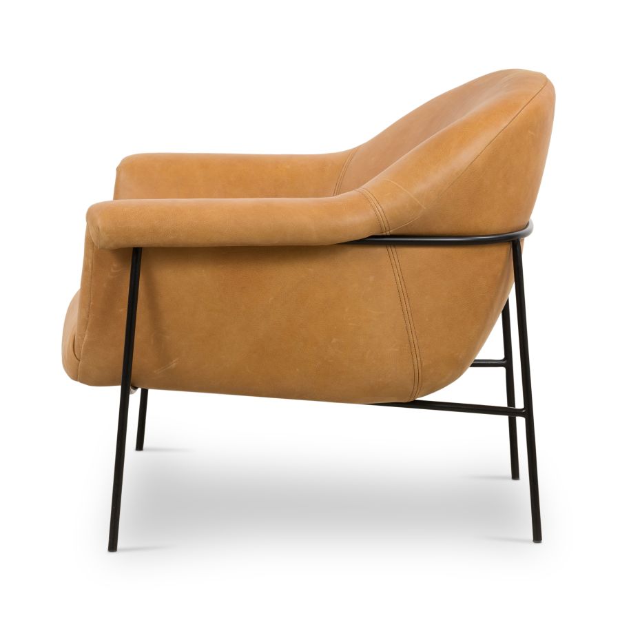 Butterscotch leather mid-century style chair on black metal base.