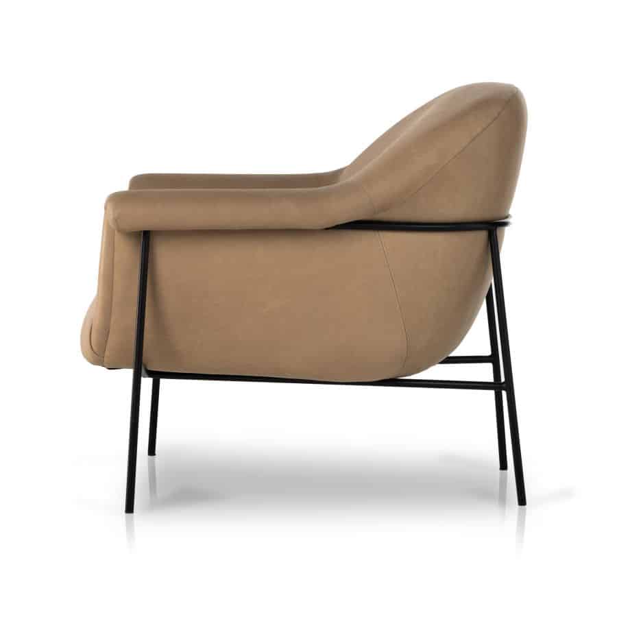 Stylish mid-century style leather chair in butterscotch or nude, featuring black iron base.