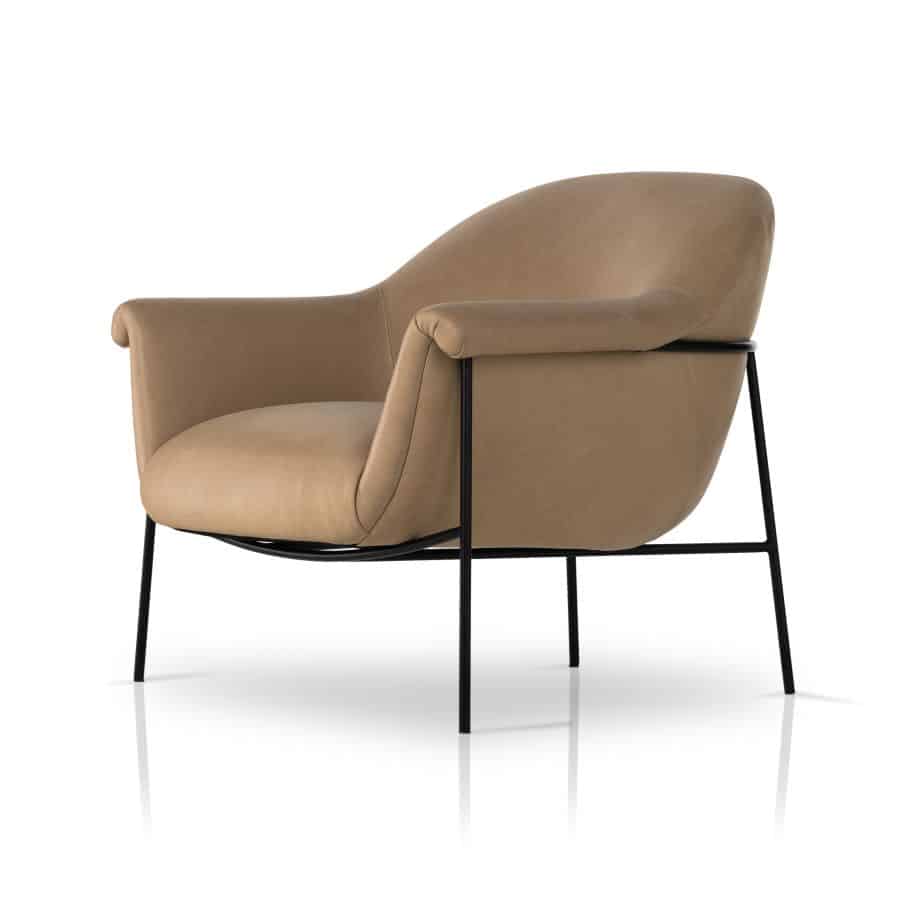 Stylish mid-century leather chair in nude color with black iron base.
