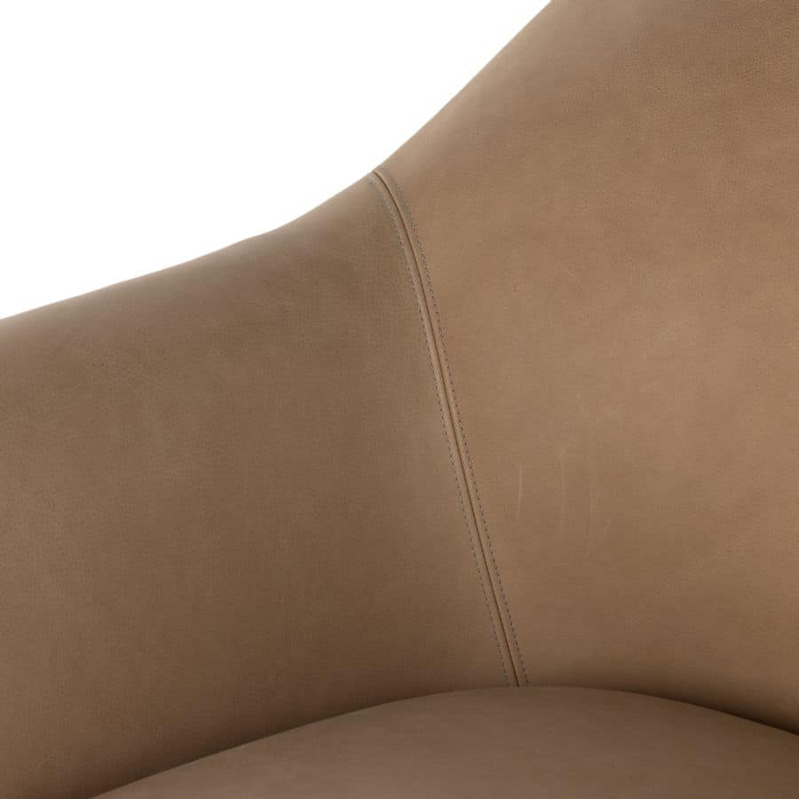 Close-up of butterscotch leather chair accentuating mid-century style design.