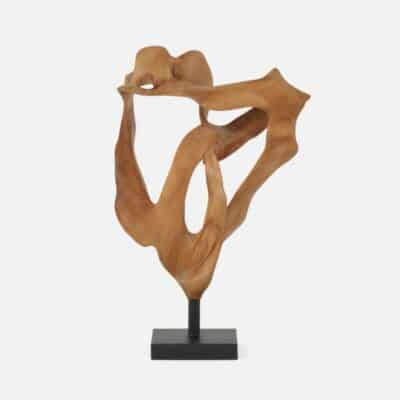 Small Teak Sculpture in natural wood, showcasing intricate details and organic shapes on display.