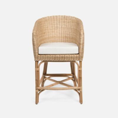 A side view of the Round Faux Wicker Counter Stool, featuring its light natural wicker pattern and an ivory cushion.