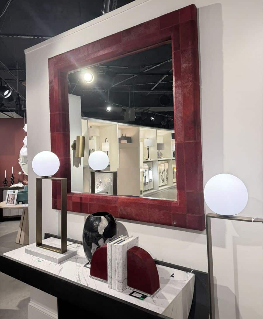 Red hair-on-hide mirror with quilted pattern and double stitch detail.