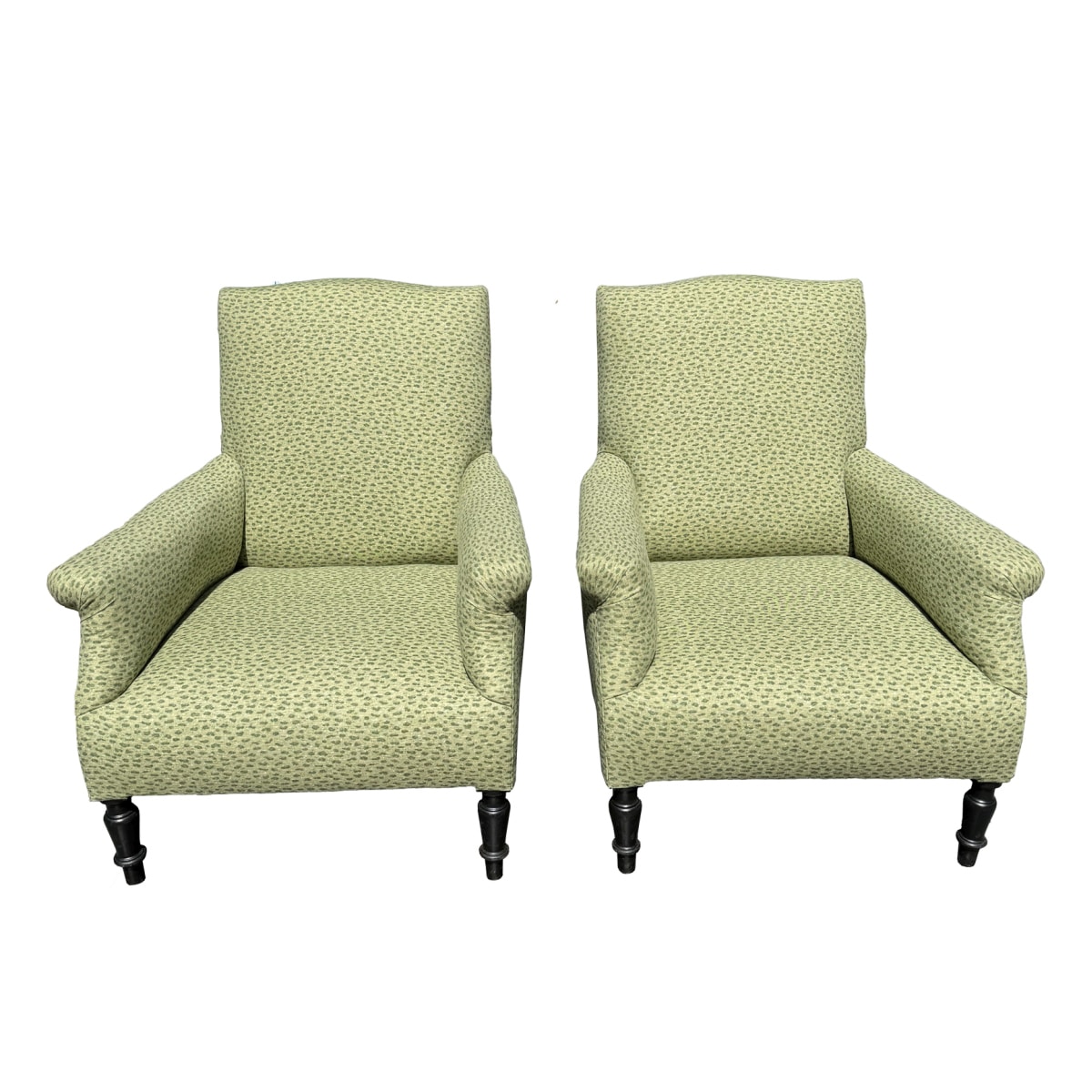 Pair of antique chairs with floral upholstery, rolled arms, and nailhead detail.