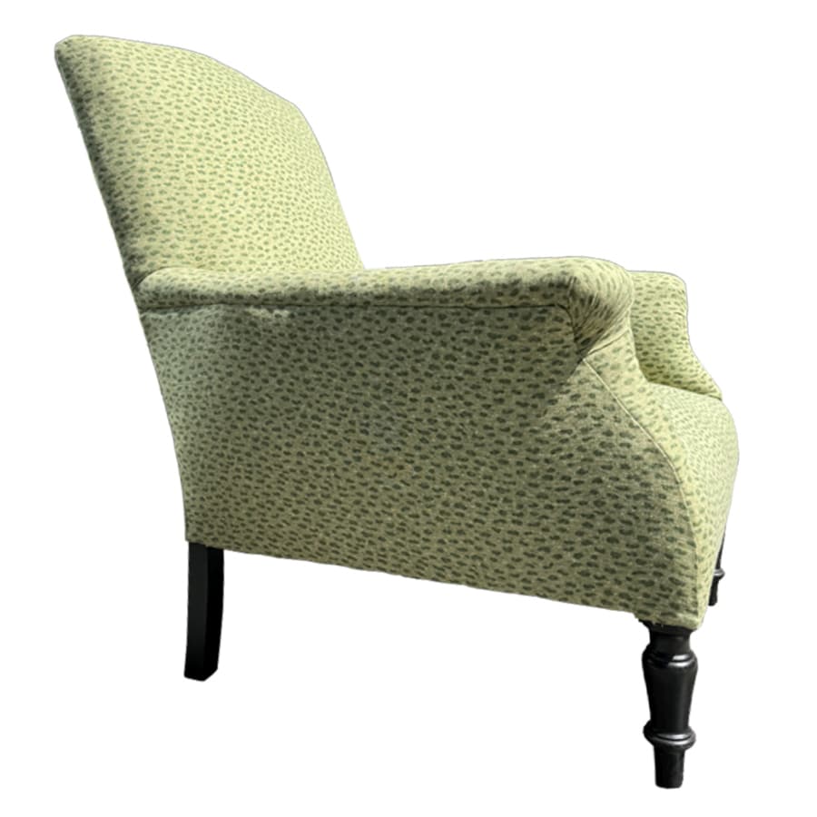 Close-up of Antique Upholstered Chair with Rolled Arms, Nailhead Detail and Green Floral Pattern.