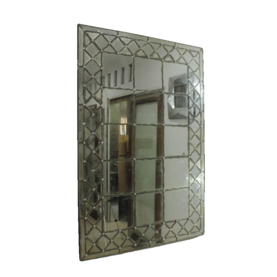 Antiqued mirror panel with intricate lattice edge, showcasing an elegant Hamptons-style design.