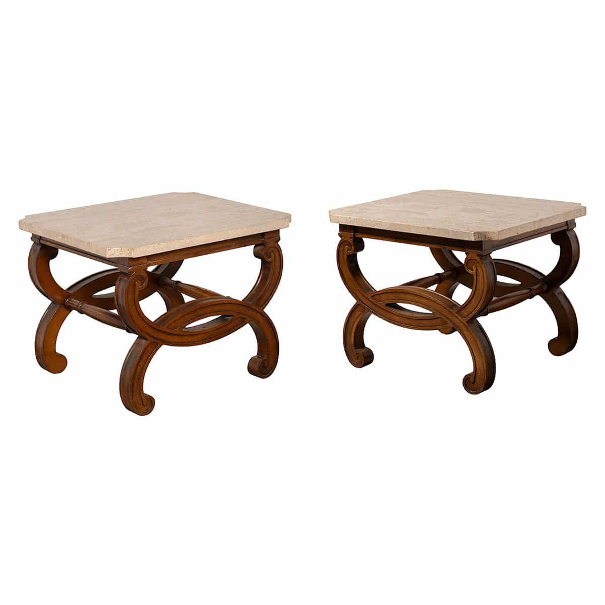Pair of ornate travertine coffee tables in vintage condition, each featuring an oval design and fruitwood finish.