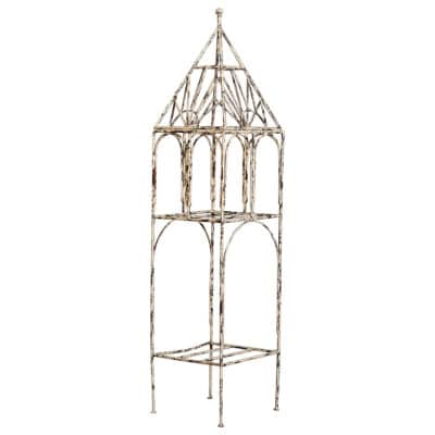Antiqued cream metal pagoda-style shelf with ornate details, not suitable for outdoor use.