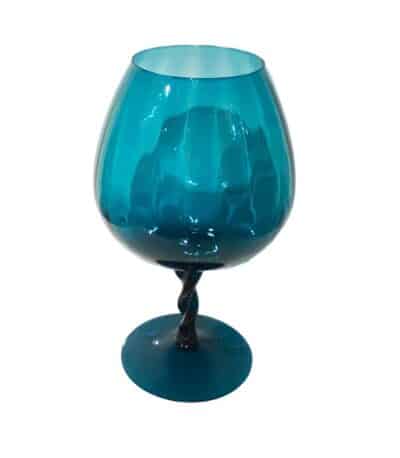 Close-up of vintage Italian blue glass vase with elegant stemmed design, circa 1960s.