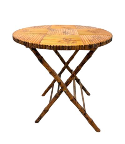 Vintage burnt bamboo round folding table, side profile.