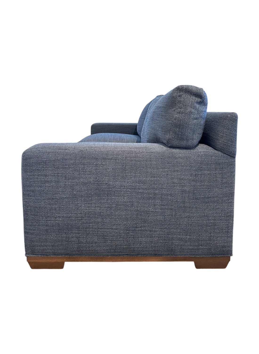 Stylish blue upholstered apartment sofa with weathered grey legs, inviting comfort for your living space.