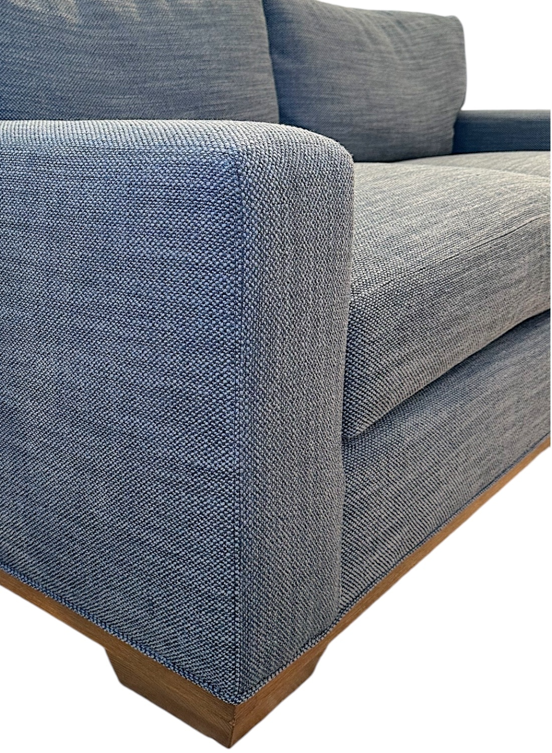 Close-up of Apartment Sofa in Carter Blue Upholstery with Weathered Grey Finish Legs, showcasing plush texture and modern design.