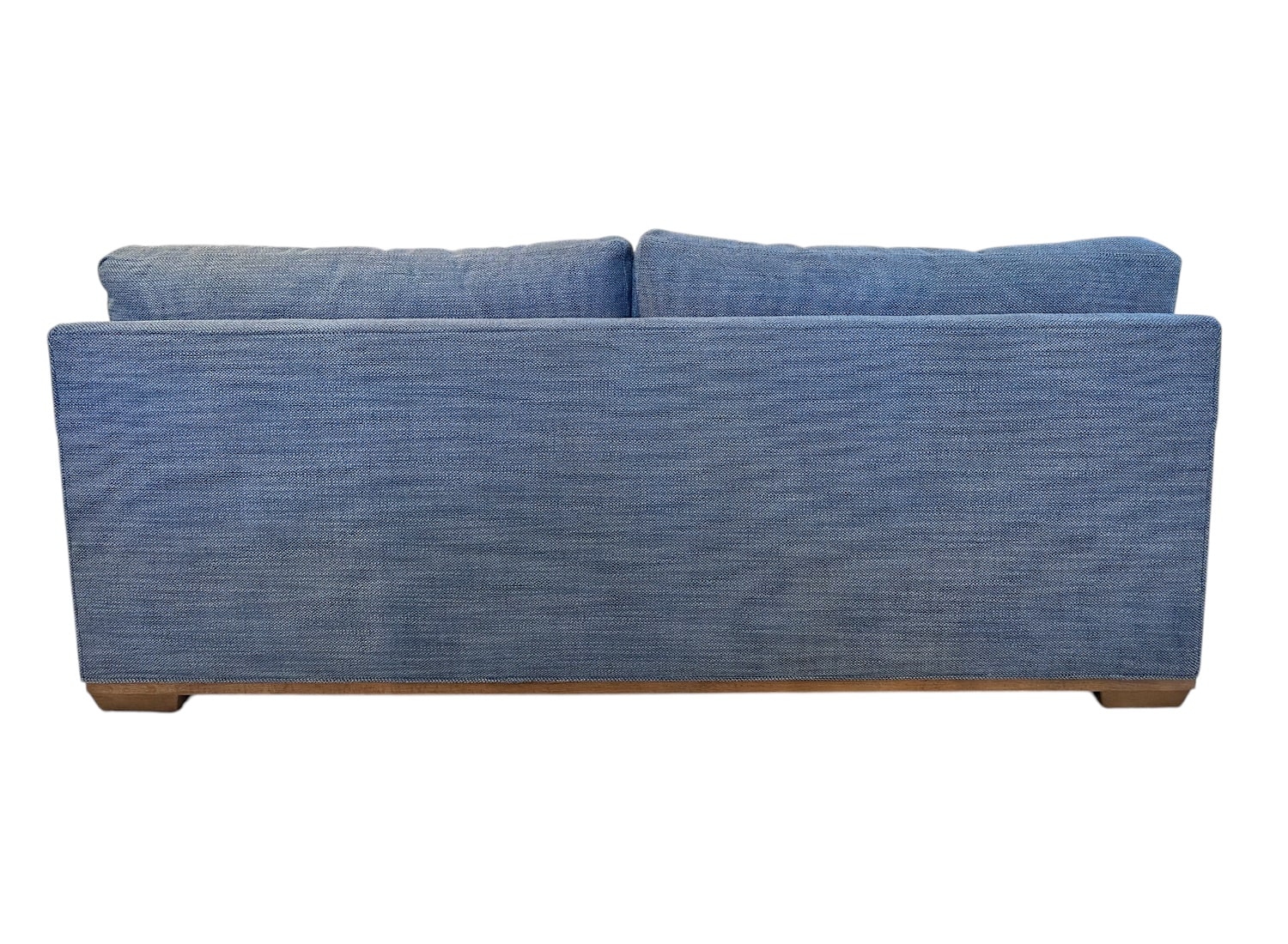 Close-up of blue apartment sofa in Carter Blue Upholstery, showcasing weathered grey legs.