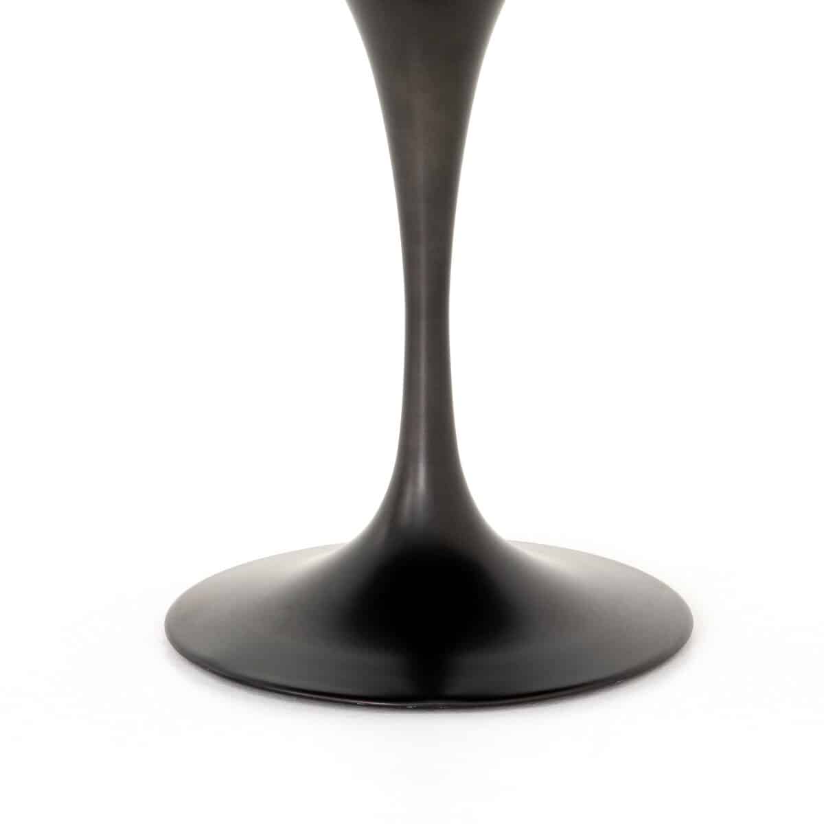 Close-up of 42" Powell Dining Table with white marble top and rustic black iron base, showcasing its elegance and durability.