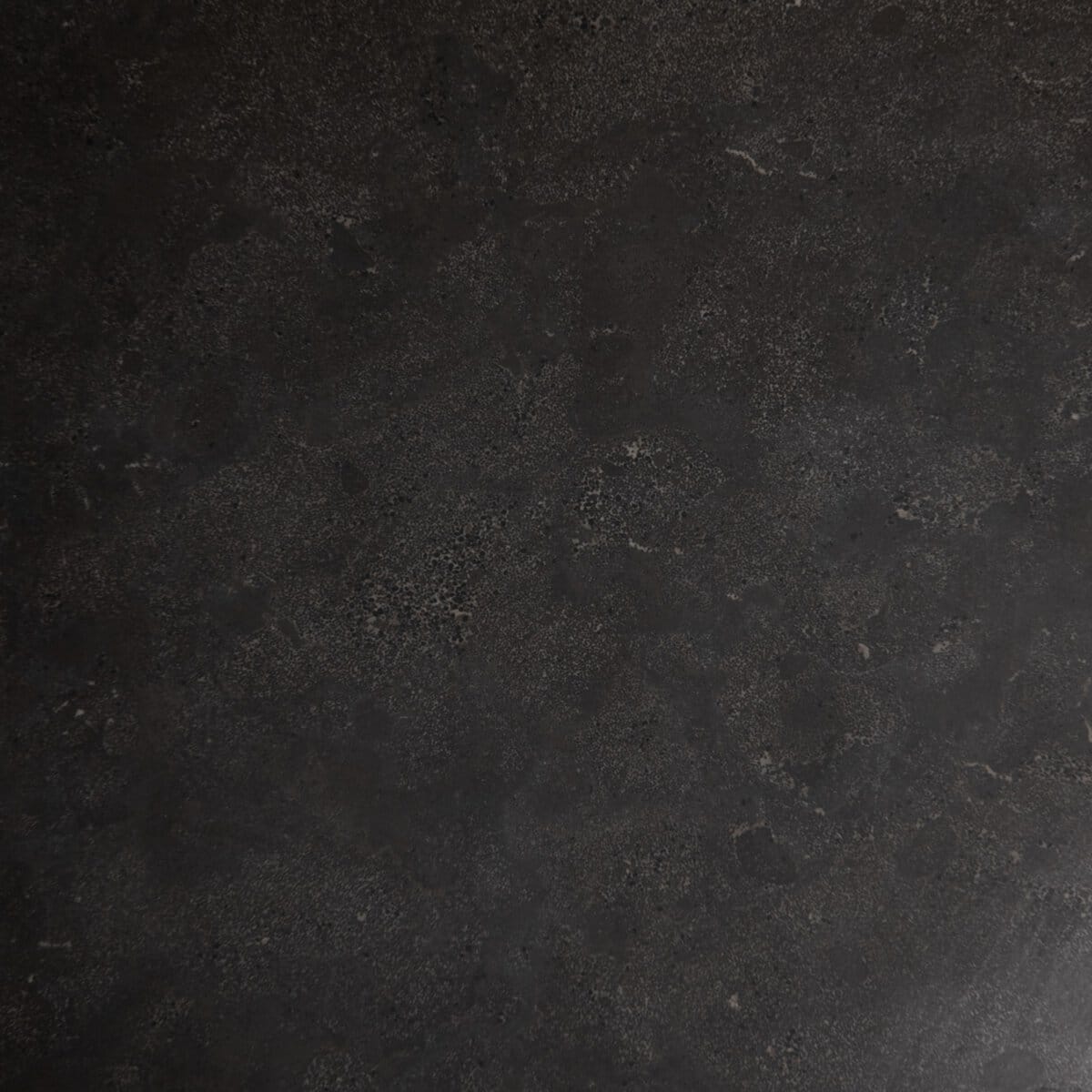 Close-up of 42 inch round dining table, featuring white marble top and rustic black iron finish base.