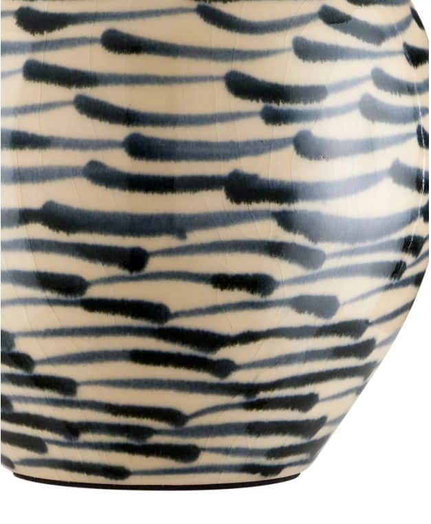 Close-up of Minnow Blue Table Lamp featuring navy blue and beige ceramic finish.