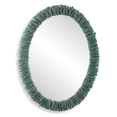 Oval mirror with turquoise ceramic border, close-up front view.