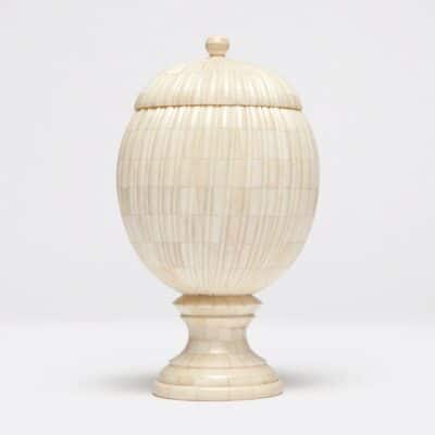 Side view of bone urn with vertical ribs.