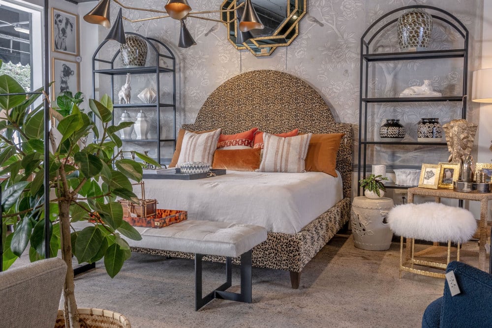Front view of Valerie King Bed in Jaguar Print featuring heavy duty cotton polyester upholstery and weathered gray finish.