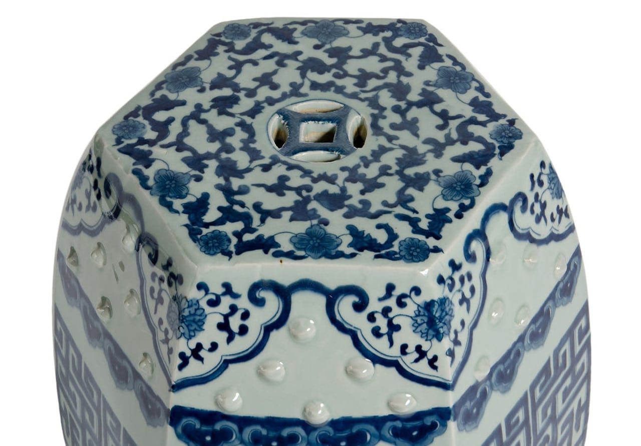 Hexagonal garden stool with intricate blue and white floral design.