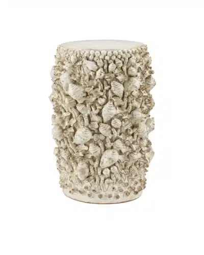 Close-up of Corfu Ivory Faux Shell Ceramic Side Table showcasing intricate shell details on pedestal base.