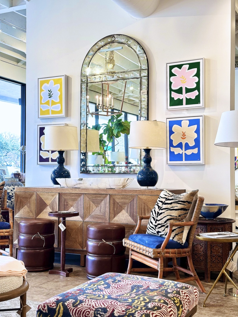 Close-up of Wild Flower Series Original Artworks in vibrant hues of blue, green, rouge, and yellow.
