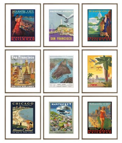 Assorted framed travel poster reproductions featuring iconic destinations in various frame styles.