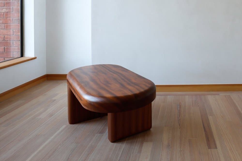Handcrafted chunk coffee table in dark wood, sleek design, perfect for modern living spaces.