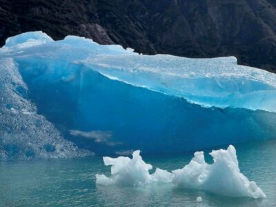Close-up of framed blue ice photograph on float mount acrylic, showcasing intricate textures and icy blue hues.