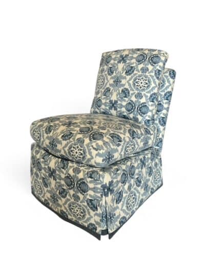 Audrey Indigo Slipper Chair, upholstered in blue and white patterned fabric with skirt detail.