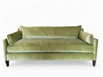 Striking Meadow Velvet Sofa with Pecan Finish Legs and Brass Fittings, perfect for any living space.