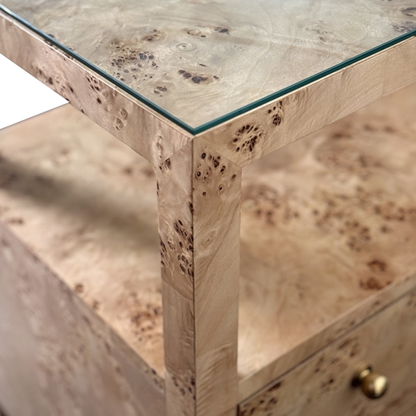Close-up of Morton Night Stand in burl wood, featuring polished brass hardware and glass top.