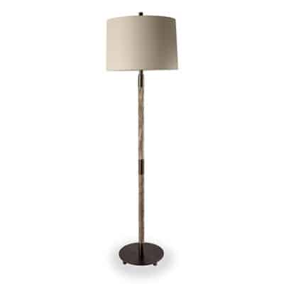 Stylish gray stone floor lamp with brass accents, standing tall in a room.