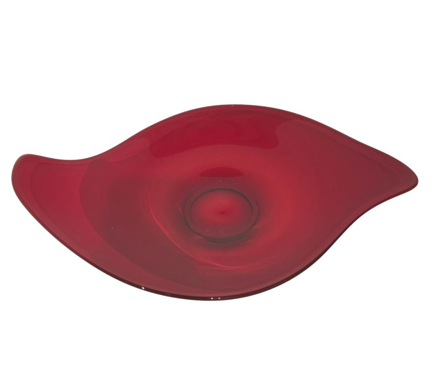 Close-up of a vintage red Viking glass amoeba platter with a central hole, circa 1950s.