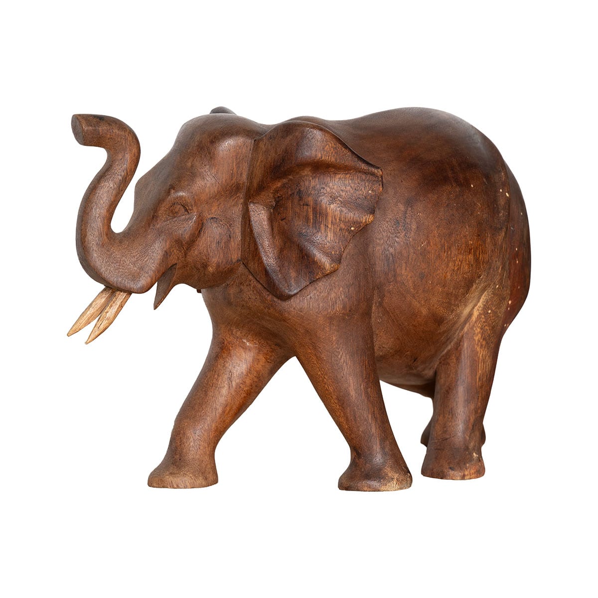 Close-up of vintage carved wood elephant with raised trunk and two tusks.