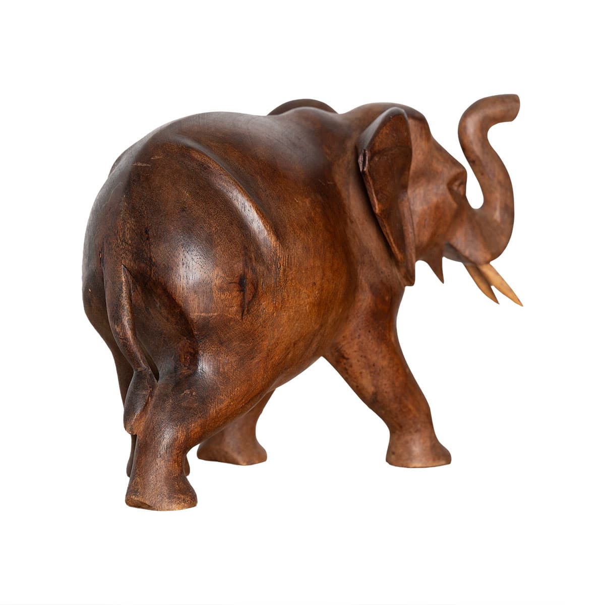 Close-up of vintage hand carved wooden elephant figurine in rich brown tones showcasing intricate details and craftsmanship.