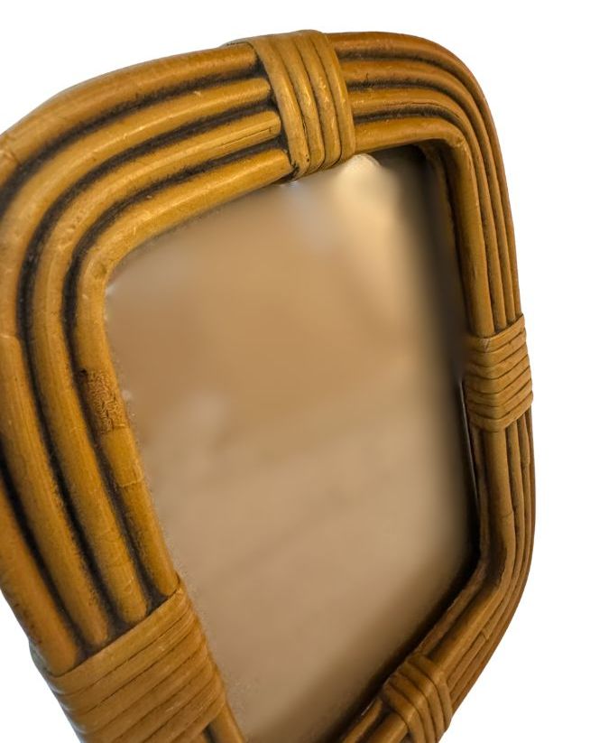 Bamboo oval frame with vintage appeal.