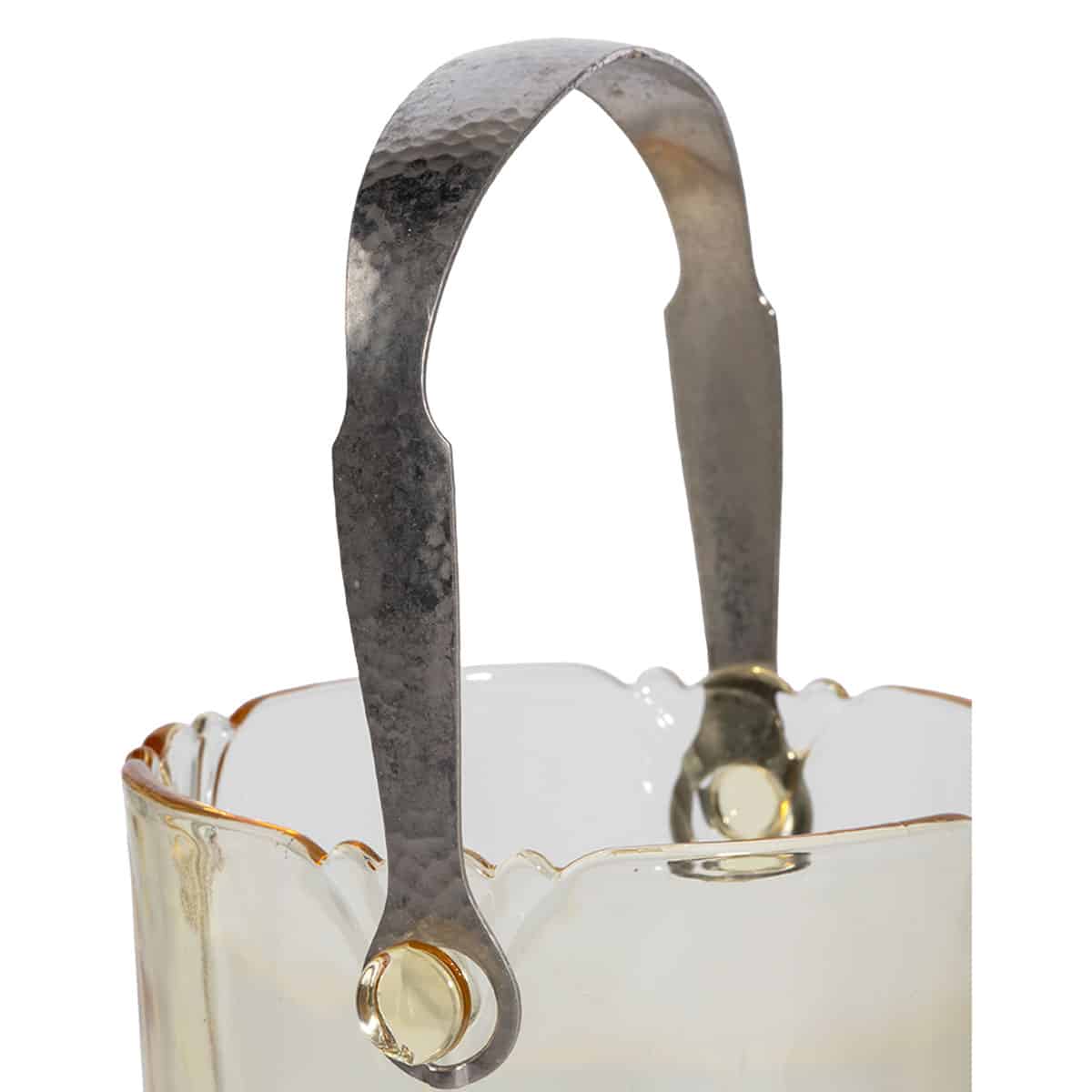 Close-up of vintage glass ice bucket featuring amber hue and metal hammered handle.