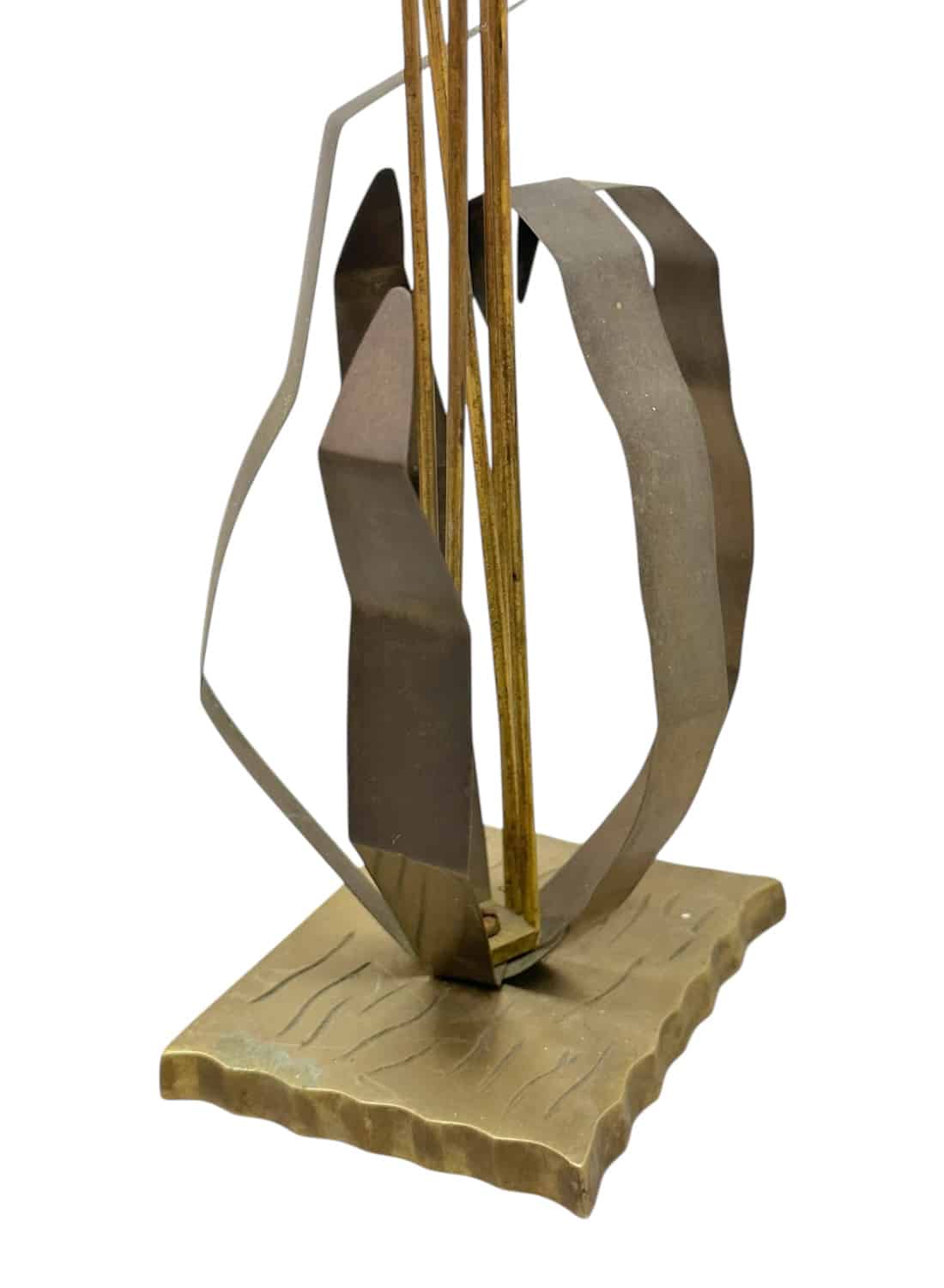 Close-up of vintage brass cattail sculpture with intricate design and smooth finish.