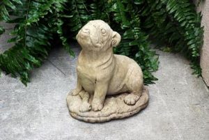 Concrete pug statue with bone, vintage style