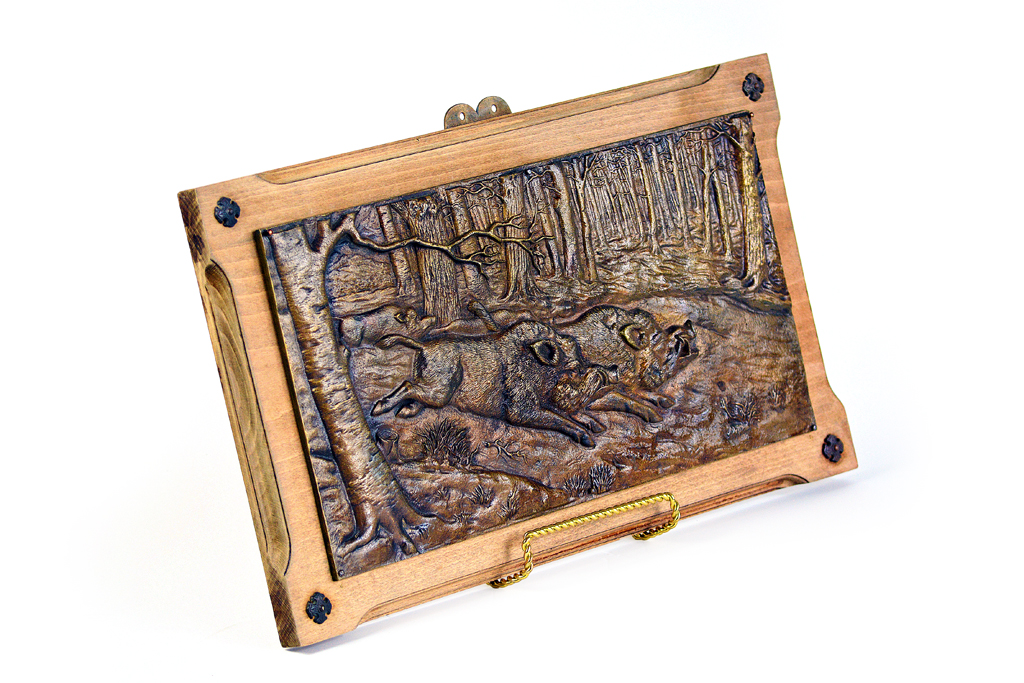 Antique French bronze boar wall plaque with relief depiction of wild boars, mounted on walnut, circa 1860