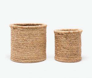 Two round woven baskets, one large and one small, displayed side by side against a white background.