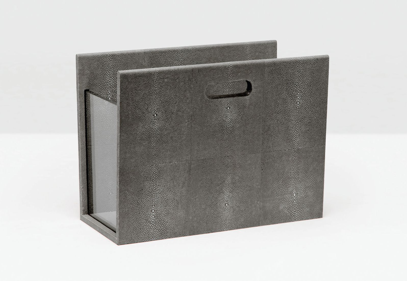A black faux shagreen magazine holder with a clear acrylic end panel and handle, displayed against a white background.