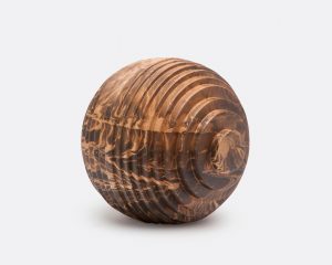 Ridged mango wood ball, natural variation in color and pattern, art and decor accessory.