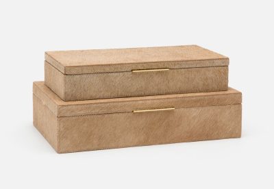 Two rectangular boxes with a hair-on hide finish and brass handles, one larger than the other, against a white background.