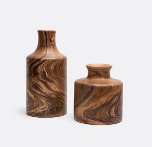 Tall and short mango wood vases on display, with natural variations in color and grain.