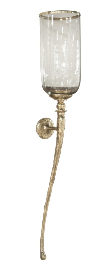 The image is a close-up photograph of a brass wall sconce with a glass cylinder shade showcasing its polished hammered finish and