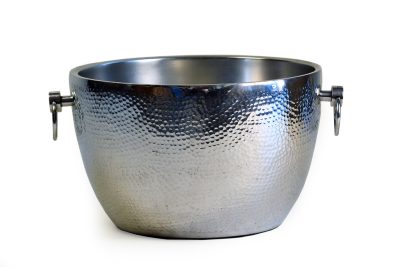 A metallic bowl with a hammered texture, positioned at an angle against a white background.